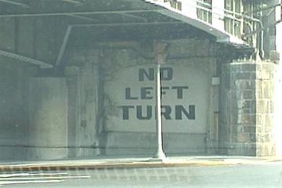 No left turn (painted on a concrete underpass)