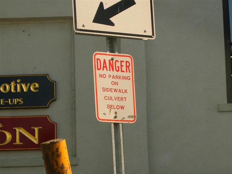 Danger; No parking on sidewalk culvert below