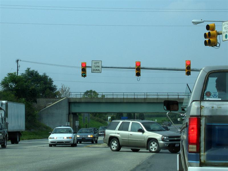 Left turn signal; Red ball and green arrow lit at the same time (pictured)