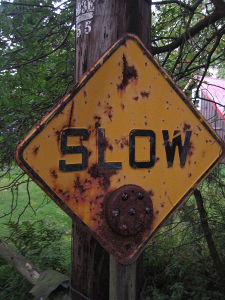 Slow (plain yellow caution sign with glass reflector)