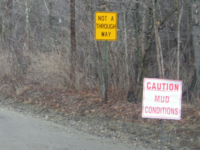 Not a through way; Caution, mud conditions