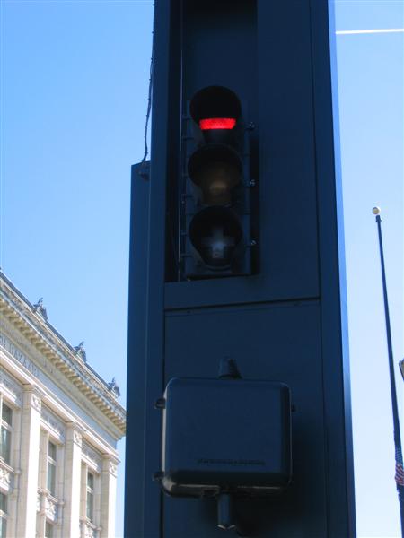 Traffic signal with minus, yellow, and plus