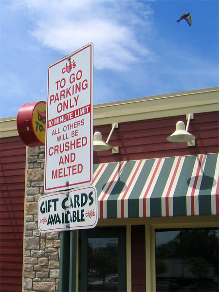 Chili's to-go parking only, 10 minute limit, all others will be crushed and melted (feat. Gift cards available plaque)