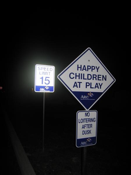 Happy children at play, No loitering after dusk, Speed limit 15 (ARC)