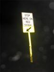 Stop here on red signal (with yellow arrow and sign post reflector)